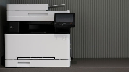 Office copier in a gray cubicle